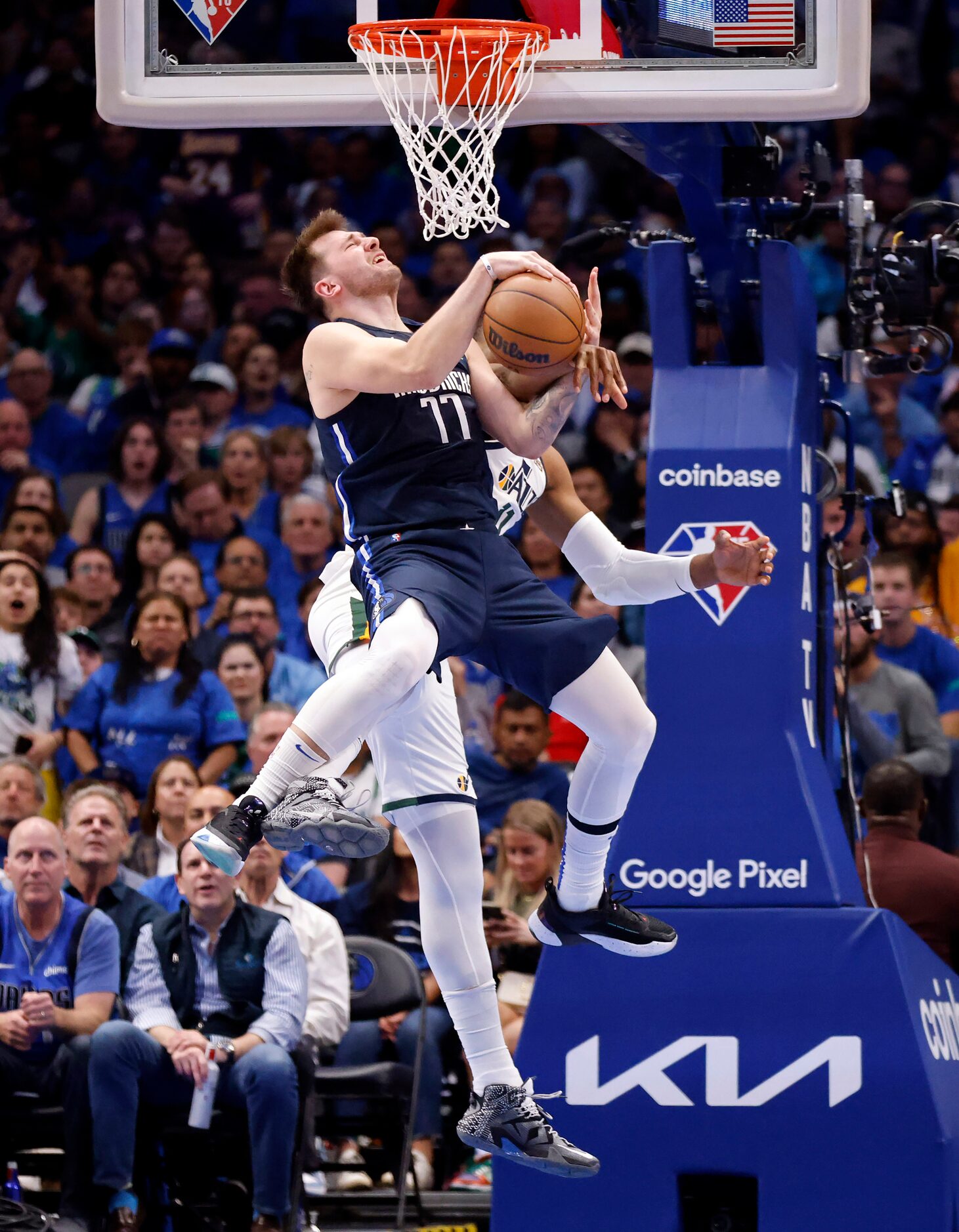 Dallas Mavericks guard Luka Doncic (77) is fouled by Utah Jazz center Hassan Whiteside (21)...