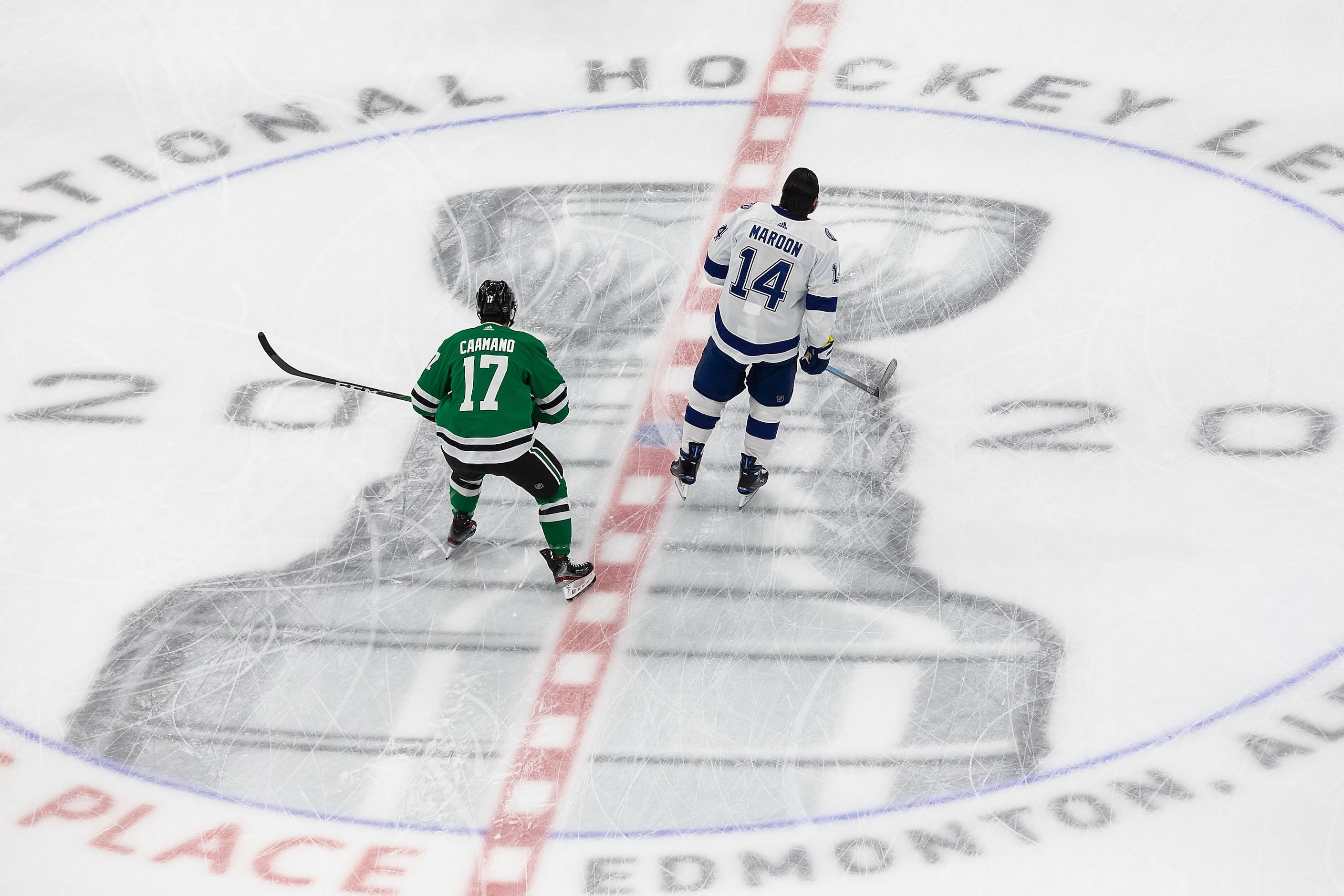 Nick Caamano (17) of the Dallas Stars and Pat Maroon (14) of the Tampa Bay Lightning warm up...