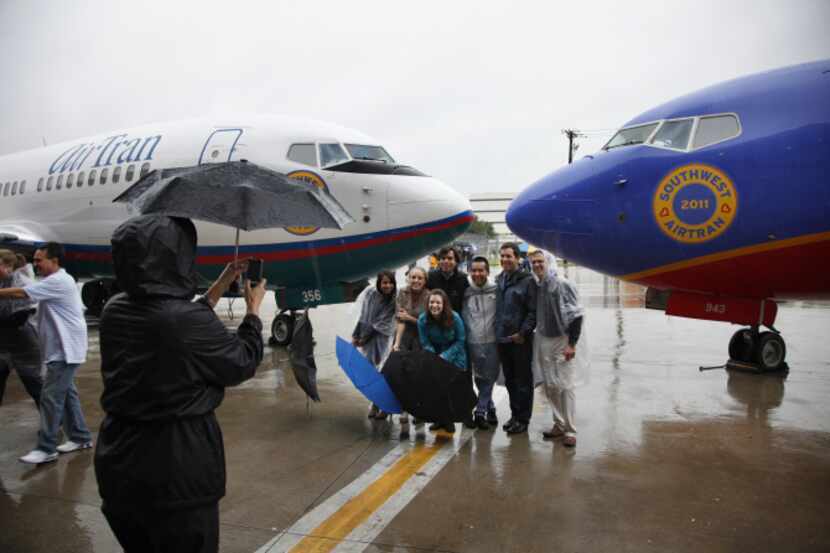 Employees of Southwest Airlines marked the merger of AirTran and Southwest at Love Field in...