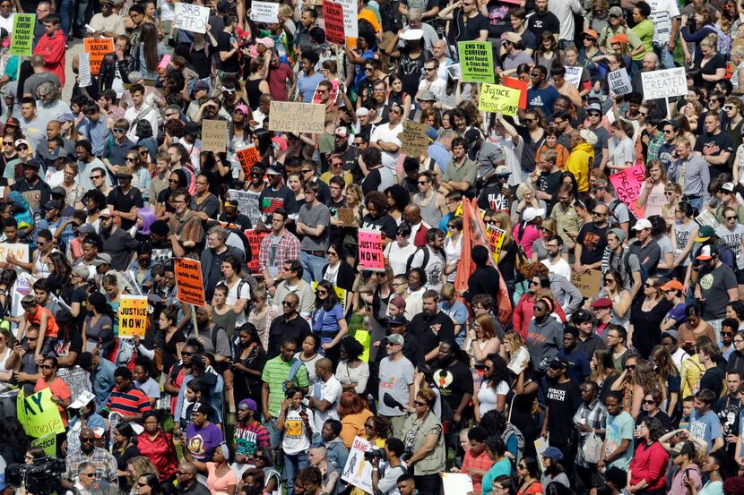 In this May 2, 2015 file photo, protesters gather for a rally outside City Hall in Baltimore...