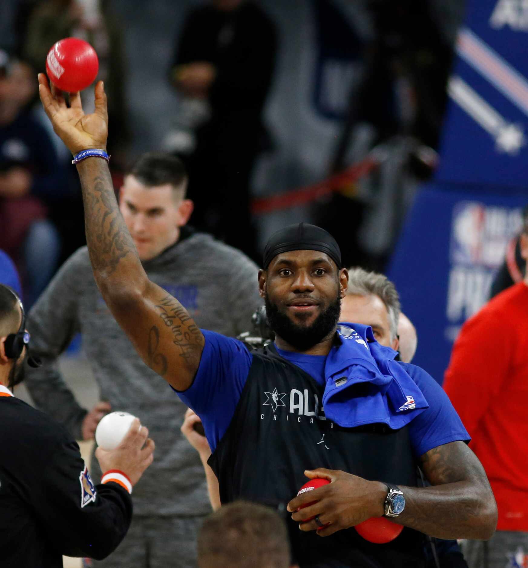 Team LeBron's Los Angeles Lakers LeBron James (23) throws a ball in the stands at the...