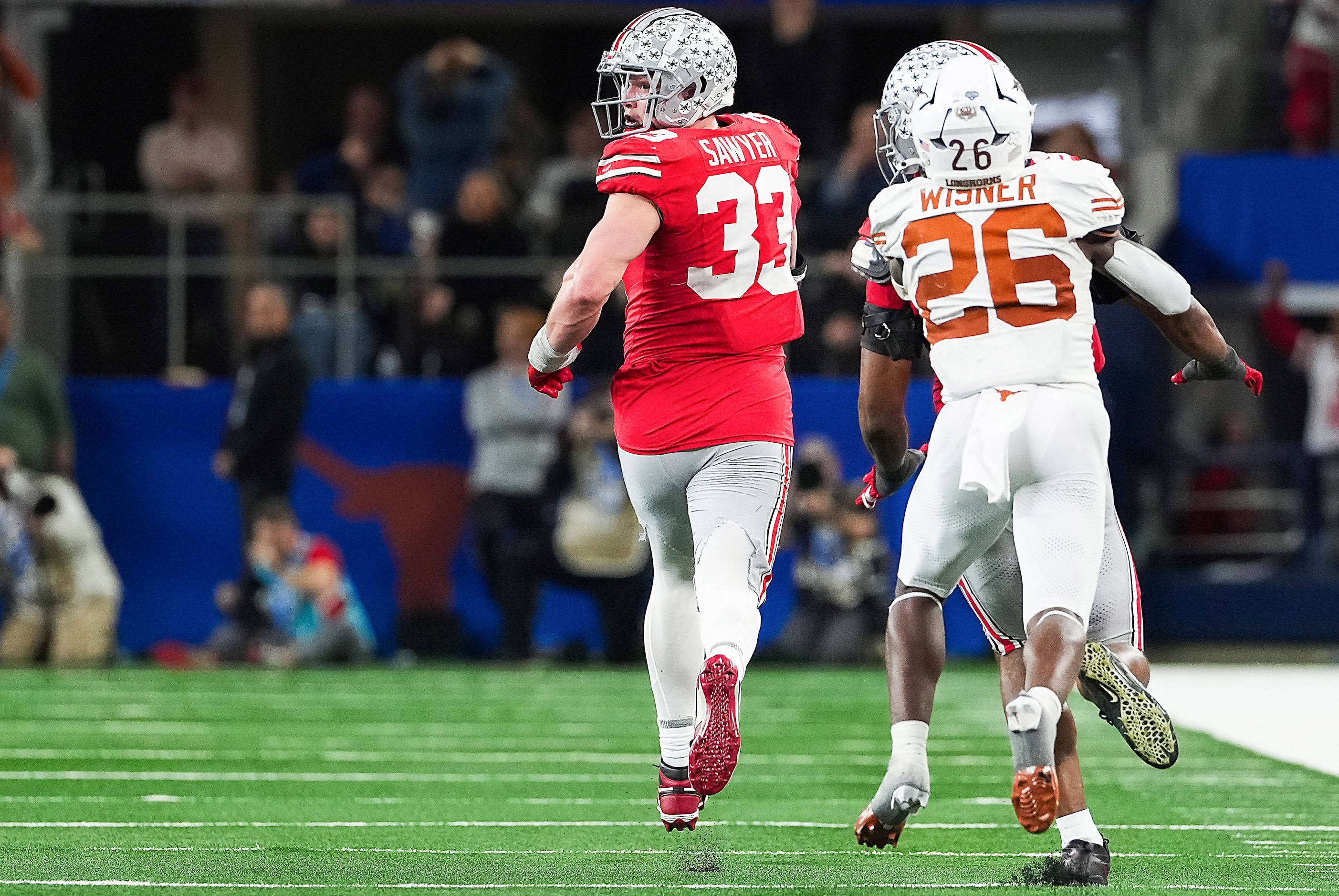 Ohio State defensive end Jack Sawyer (33) returns a fumble 83-yards for a touchdown during...