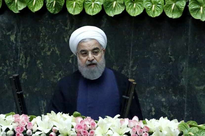 Iran's President Hassan Rouhani delivers a speech after being sworn in before parliament in...