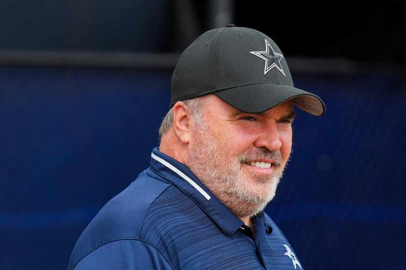 Dallas Cowboys head coach Mike McCarthy watches during a training camp walk-through on...