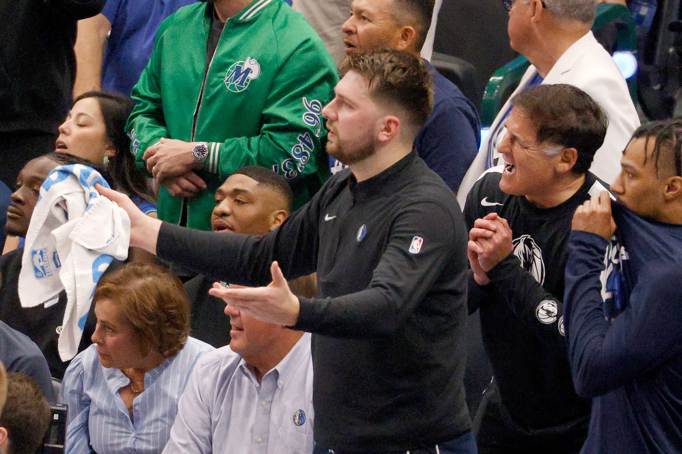 Dallas Mavericks guard Luka Doncic (77), center, and Minority owner of the Dallas Mavericks...