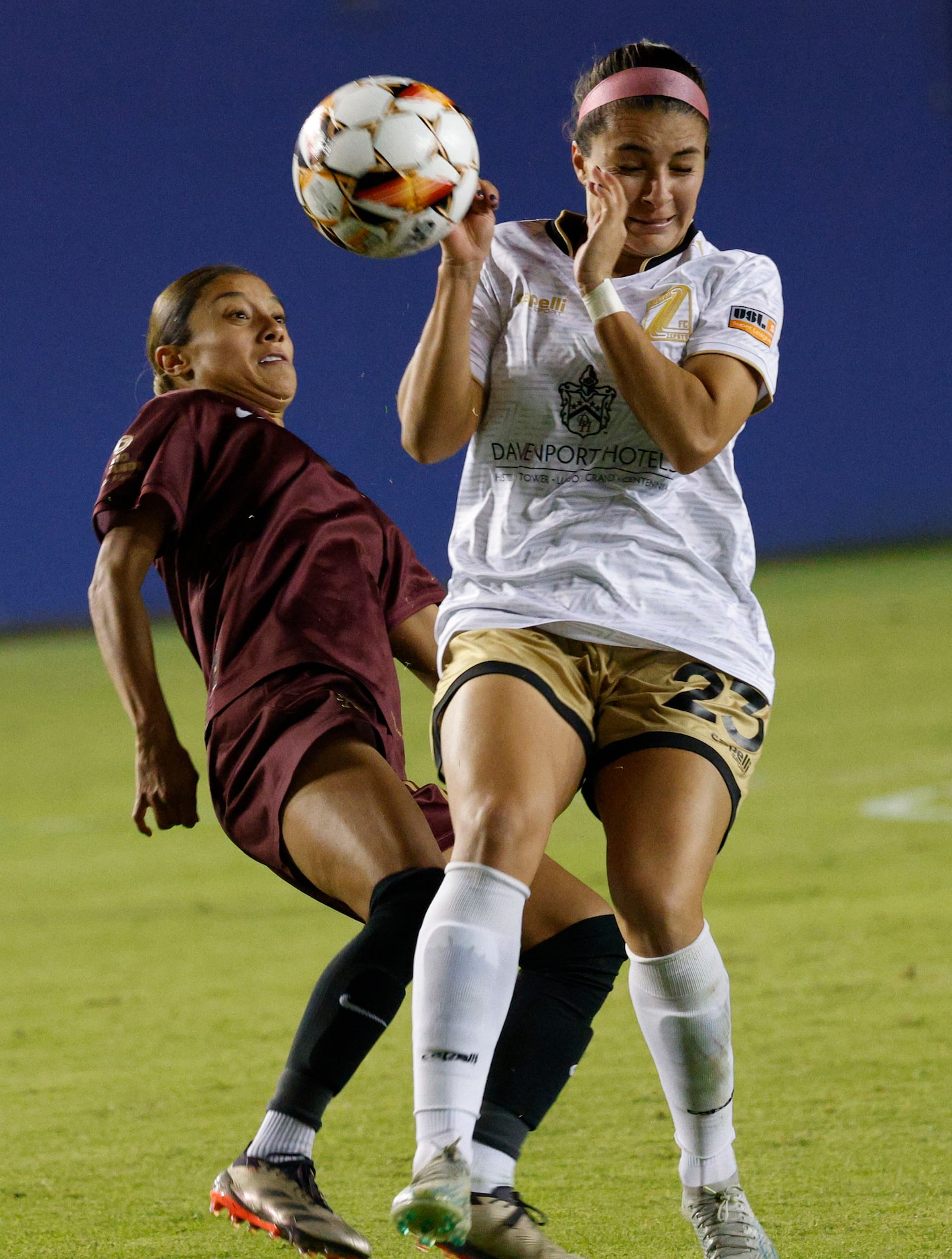 Dallas Trinity midfielder Samantha Meza, left, kicks the ball against Spokane Zephyr...