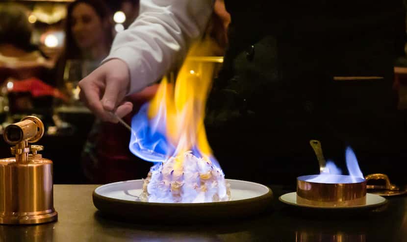 Dinner at the NoMad restaurant is as much a show as a meal, concluding with baked Alaska...