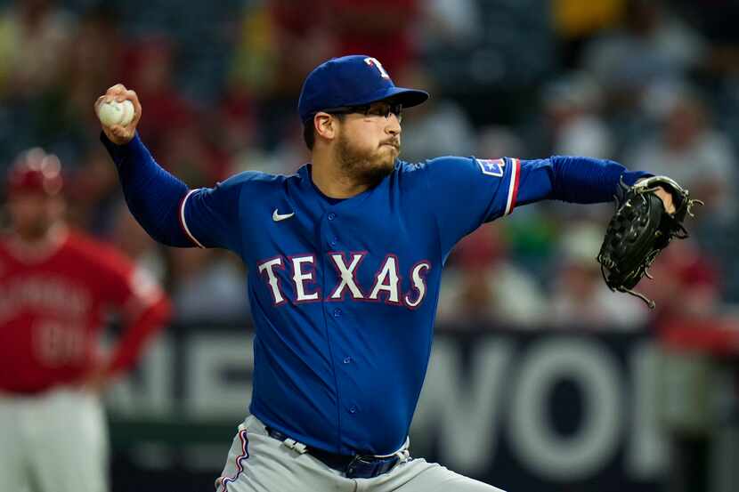 Texas Rangers starting pitcher Dane Dunning throws against the Los Angeles Angels during the...