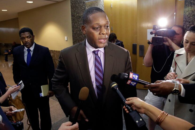  Former Dallas County District Attorney Craig Watkins speaks to reporters after a court...