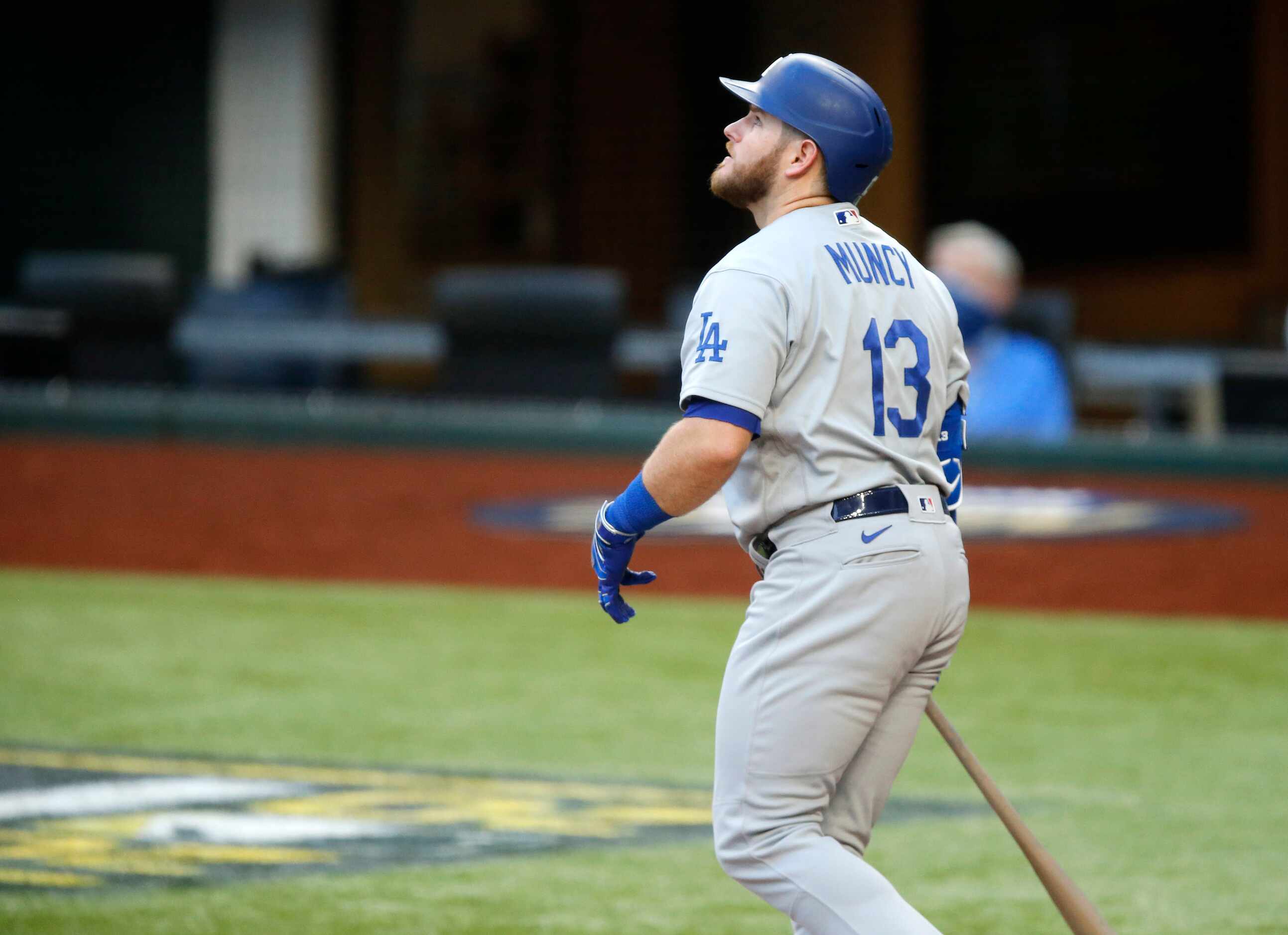 Los Angeles Dodgers batter Max Muncy (13) watches his first inning grand slam in Game 3 of...