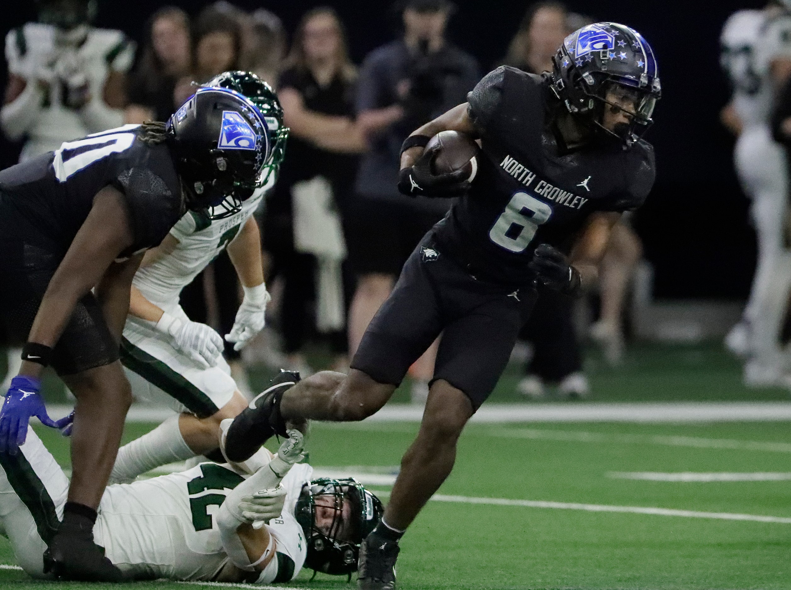 North Crowley High School running back Ashton Searl (8) steps out of a tackle attempt by...