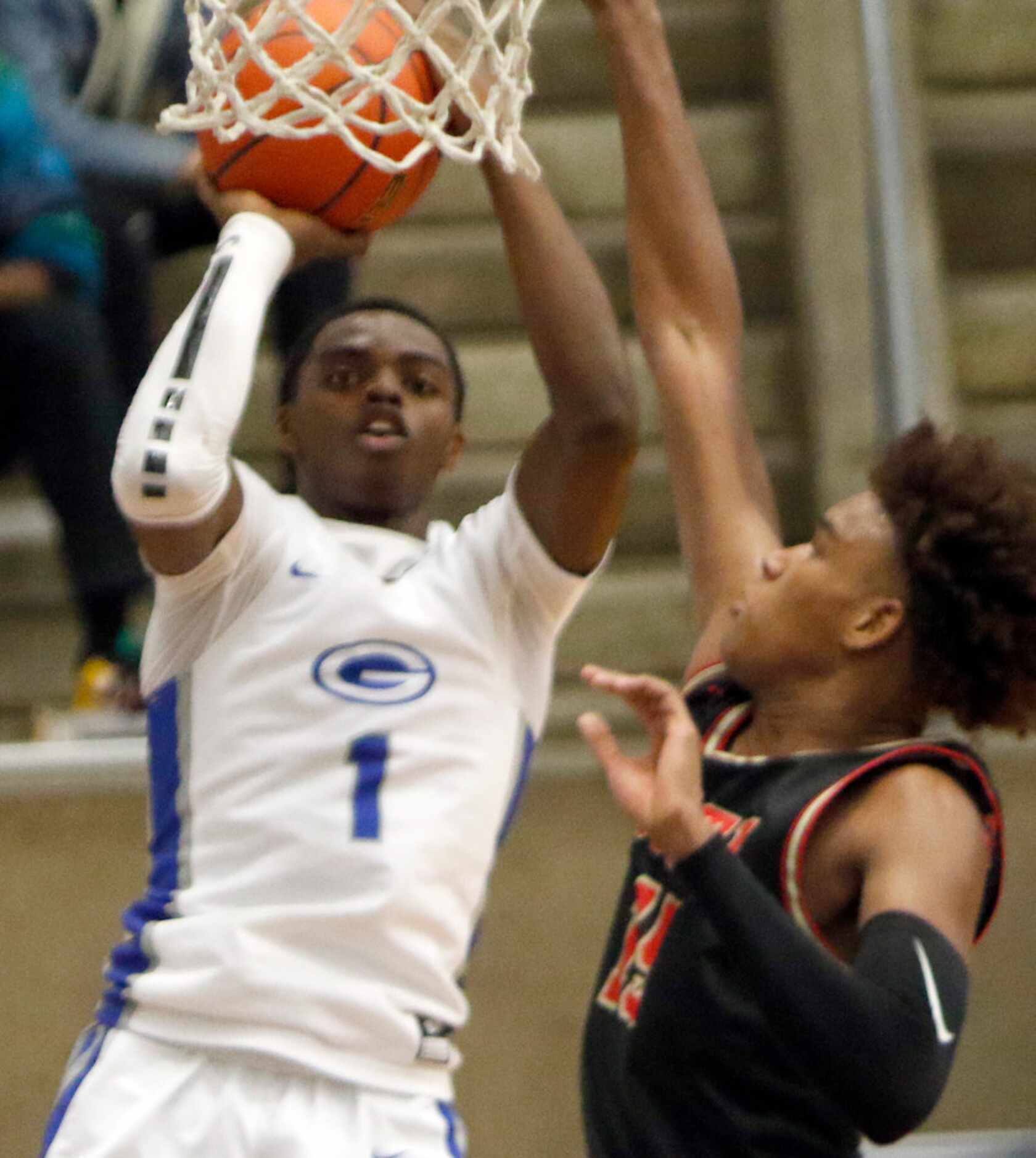 Grand Prairie's Jaylin Posey (1) shoots over the defense of South Grand Prairie's Christian...