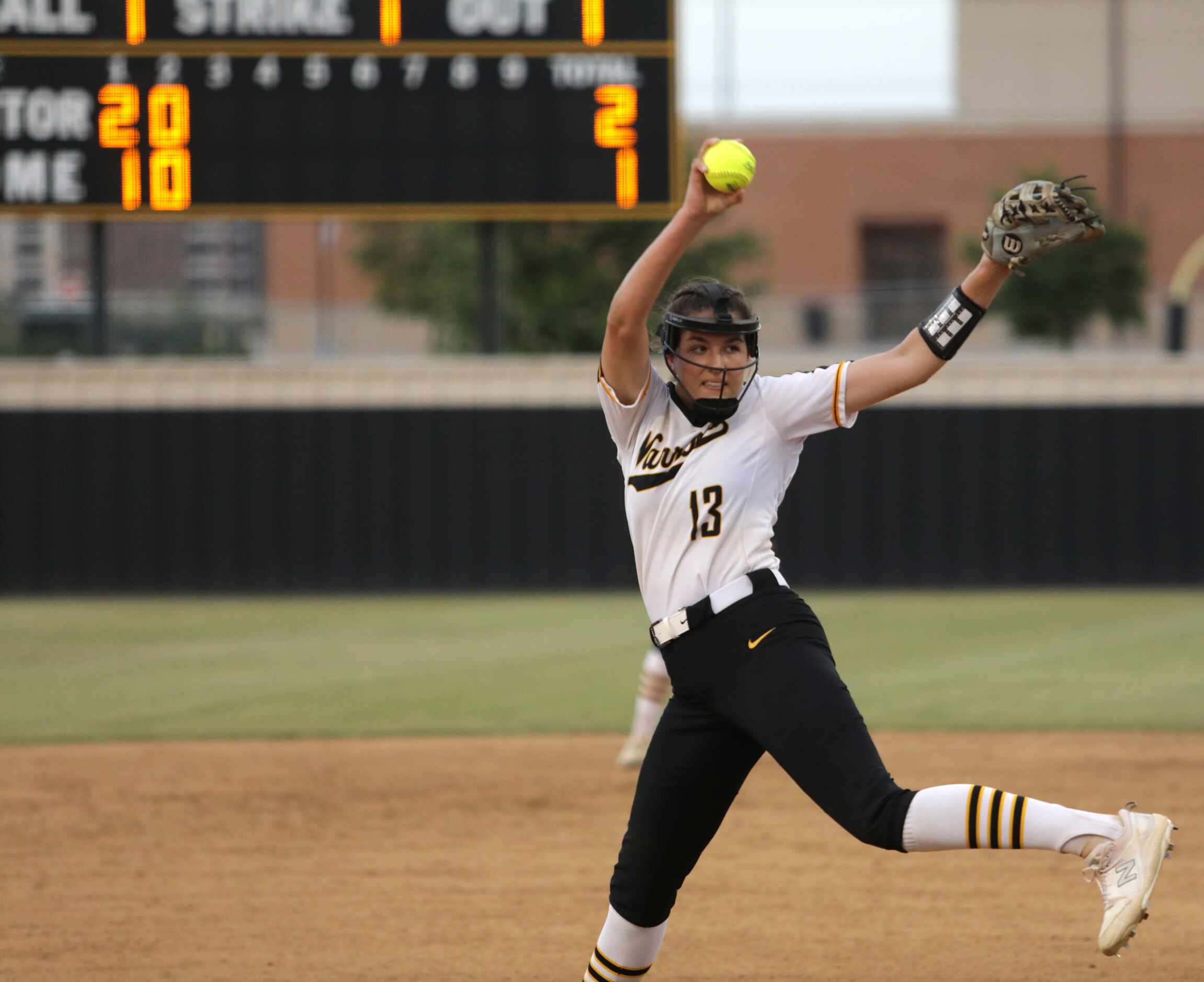 Frisco Memorial High School #13, Madelyn Muller, pitches during a softball game against The...