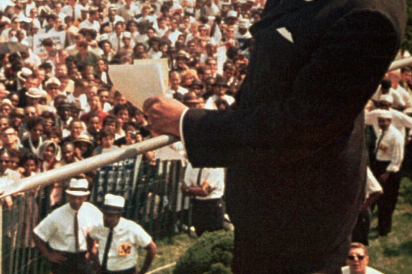 The Rev. Martin Luther King Jr. waves to the crowd at the Lincoln Memorial on Aug. 28, 1963....