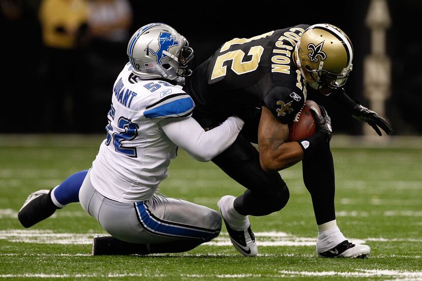 Wide receiver Marques Colston (12) of the New Orleans Saints is tackled by outside...