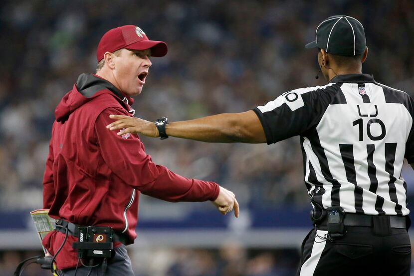 Washington Redskins head coach Jay Gruden (left) yells at line judge Julian Mapp (10) during...