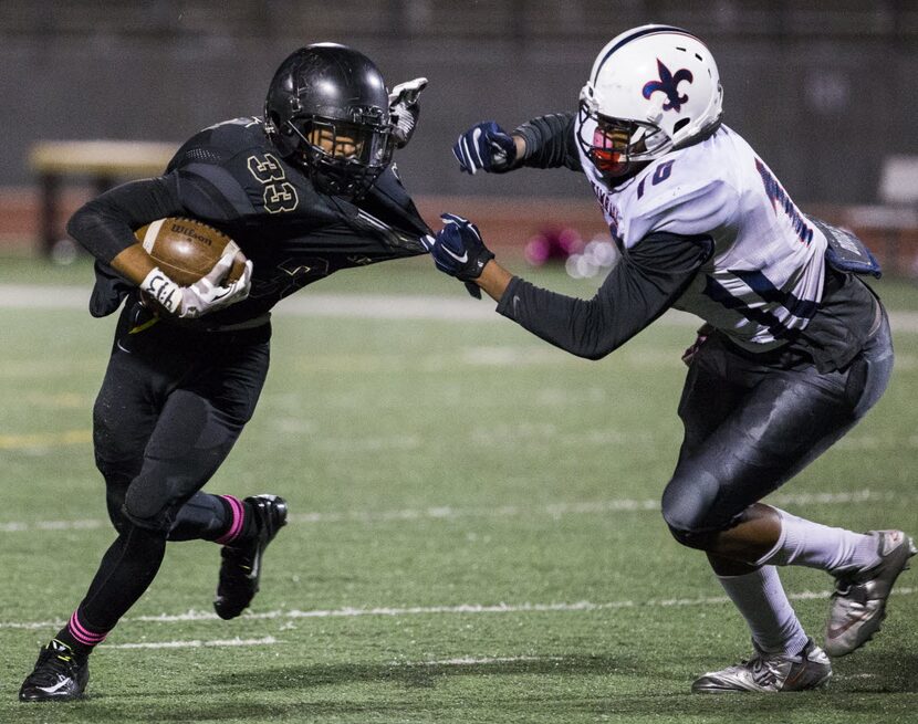 South Oak Cliff running back Tanner Chism-Wallace (33) is tackled by Kimball defensive end...