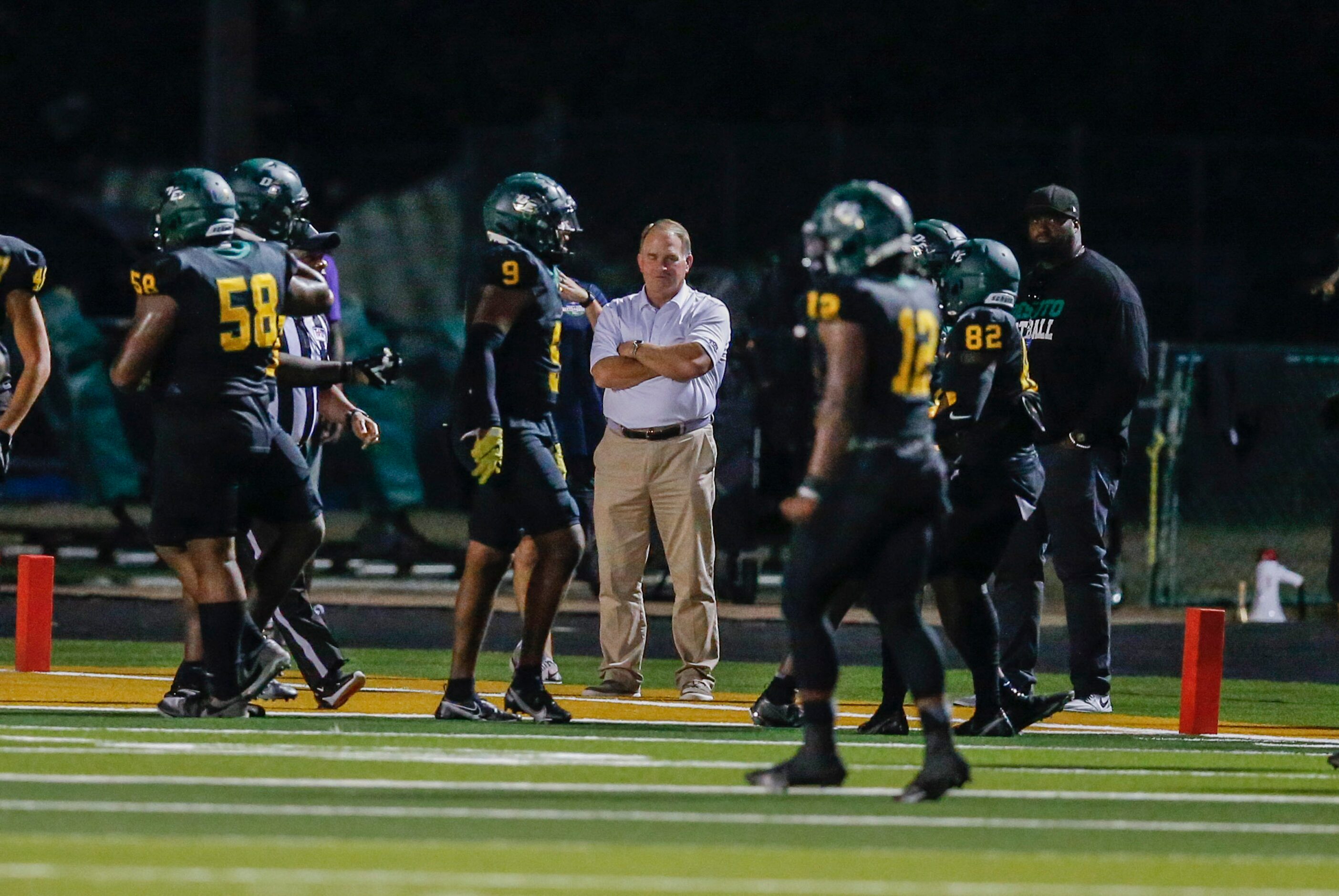 TCU head football coach Gary Patterson, center, looks on from the sidelines during the first...