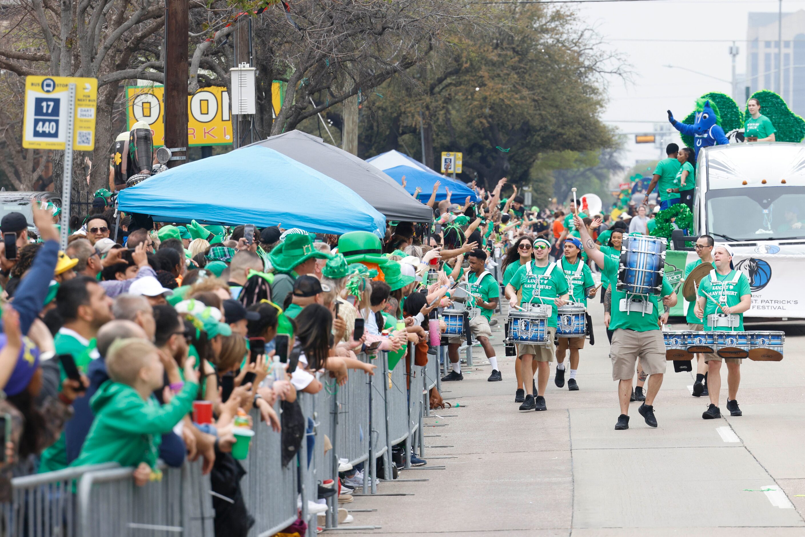 Dallas Mavericks drumline entertain the crowd during a Saint Patrick's Day parade on...