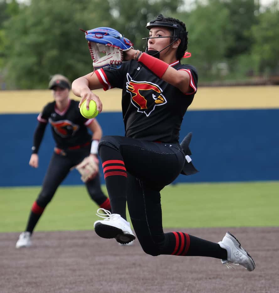 Melissa pitcher Eloisa Maes (23) delivers the third strike to a Frisco Wakeland batter to...