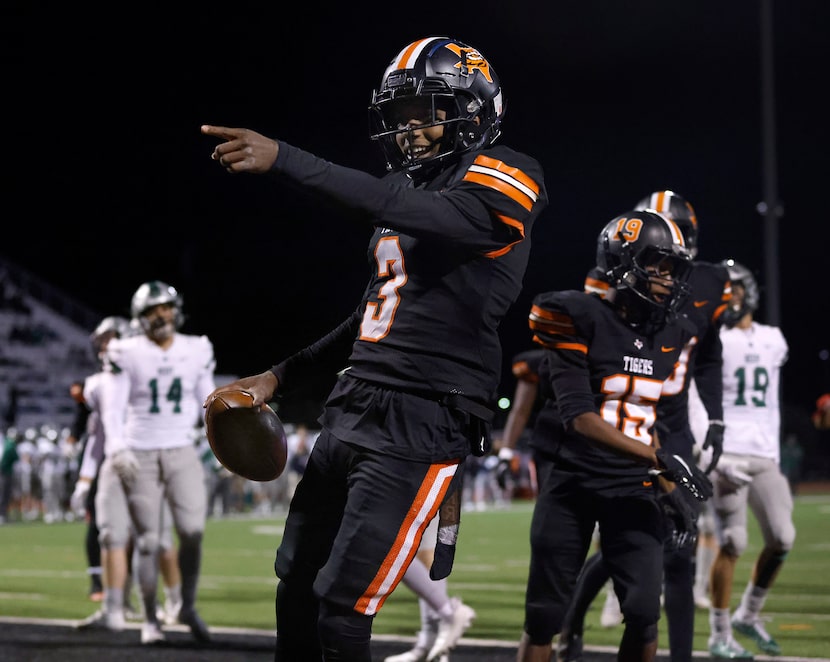 Lancaster quarterback Glenn Rice (3) celebrates his third quarter touchdown run against...