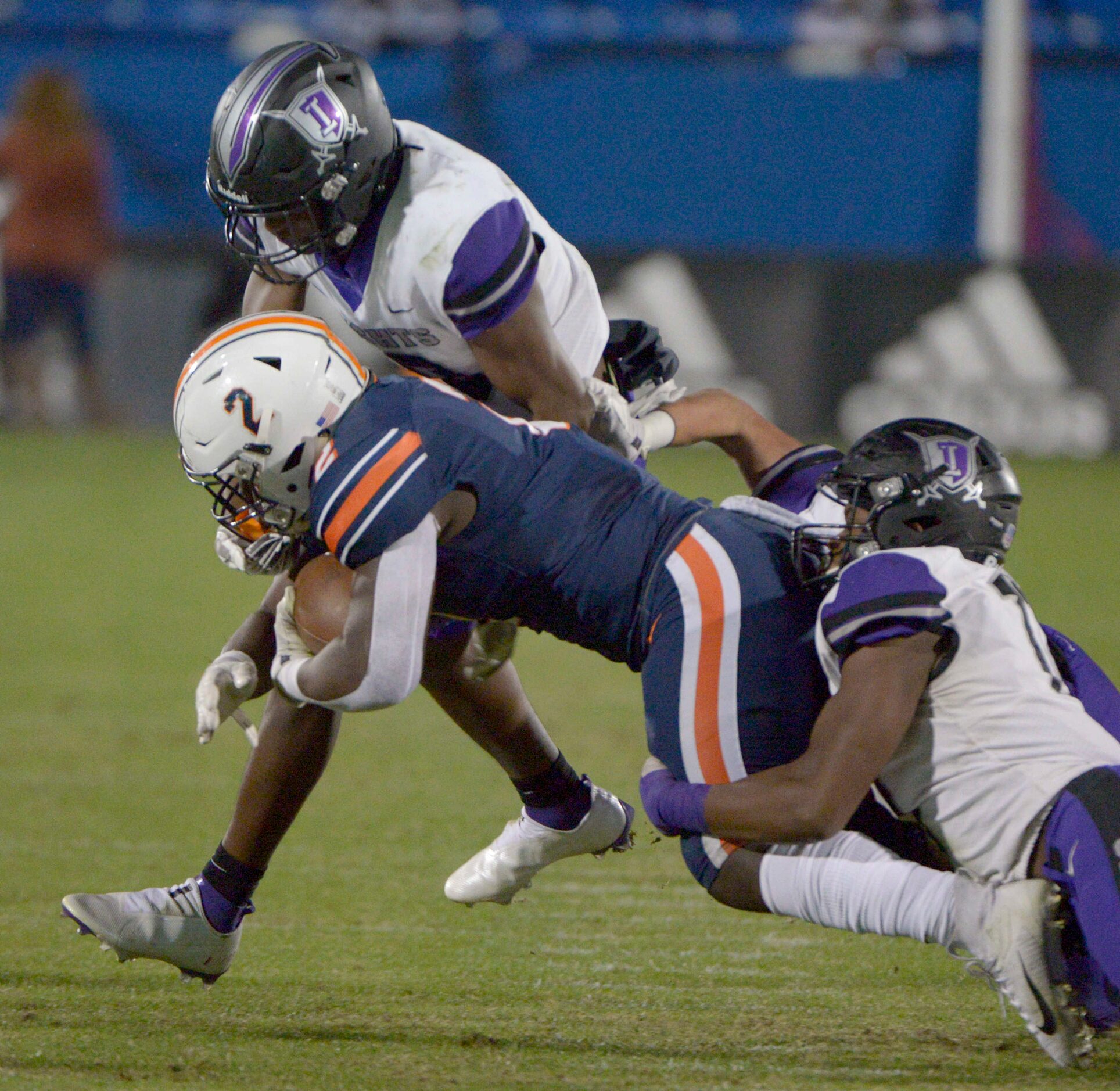 Frisco Independence Ethan Taite, left, and Jaden Wallace tackle Wakeland’s Jared White (2)...