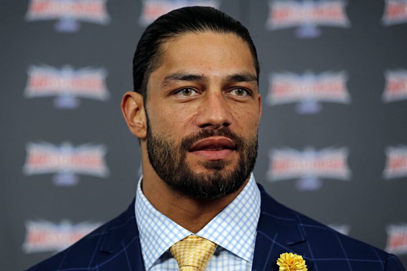 WWE Superstar Roman Reigns talks to media during a press event Friday, April 1, 2016 at...