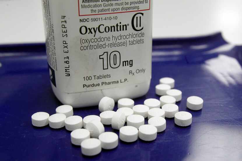  In this Feb. 19, 2013 file photo, OxyContin pills are arranged for a photo at a pharmacy in...