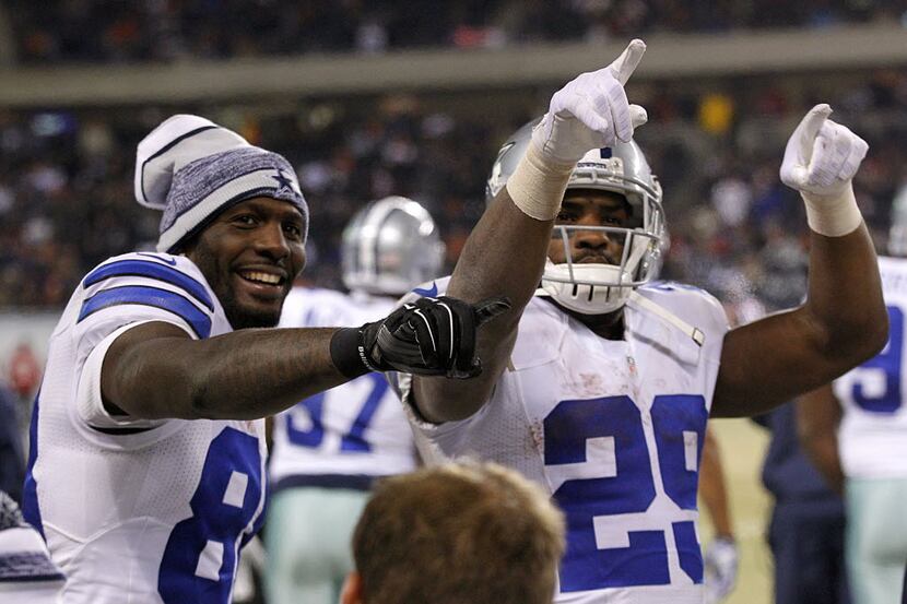 Dallas Cowboys wide receiver Dez Bryant (88) and running back DeMarco Murray (29) point to...