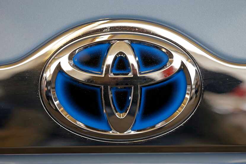 FILE - This Feb. 14, 2013 file photo shows the Toyota logo on the trunk of a Toyota...