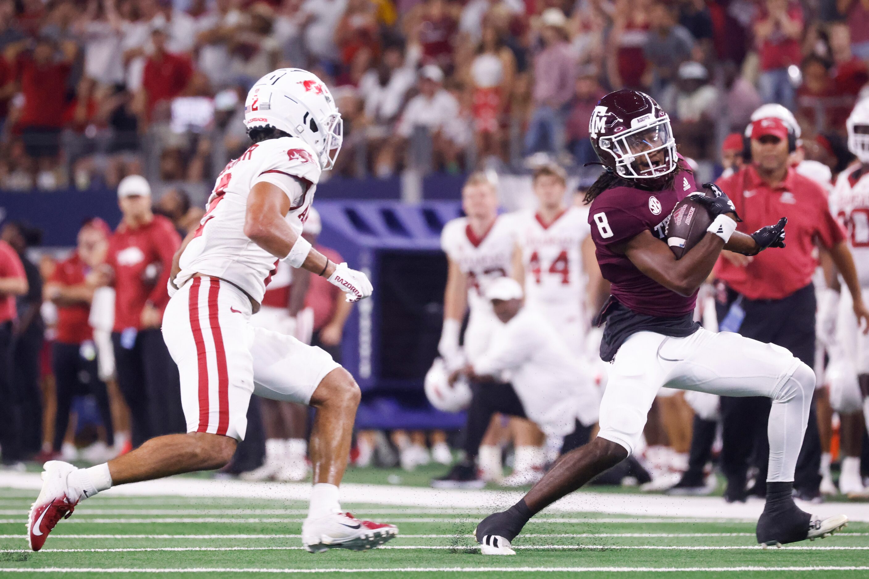 Texas A&M wide receiver Yulkeith Brown (8) runs for a yardage past Arkansas defensive back...