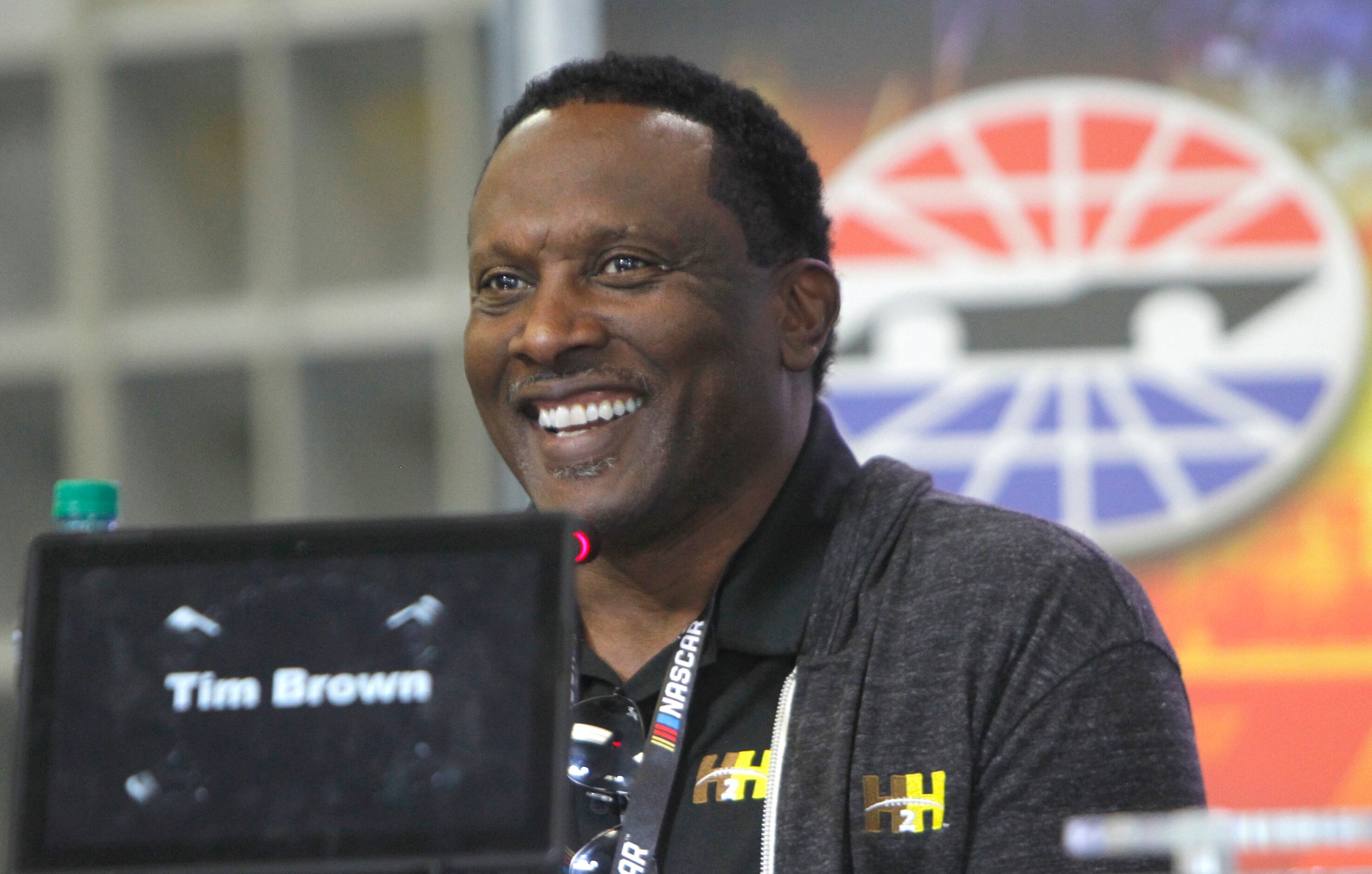 National Football League hall of fame receiver Tim Brown responds to a light moment with...
