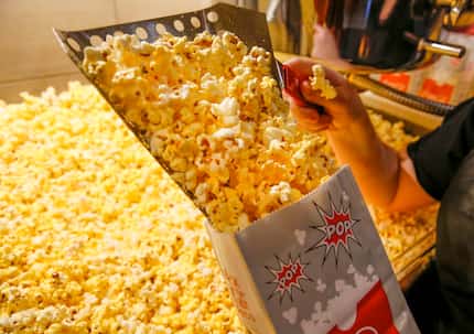 A crew member bagged popcorn at a Cinemark theater at the corner of Coit Road and Park in...