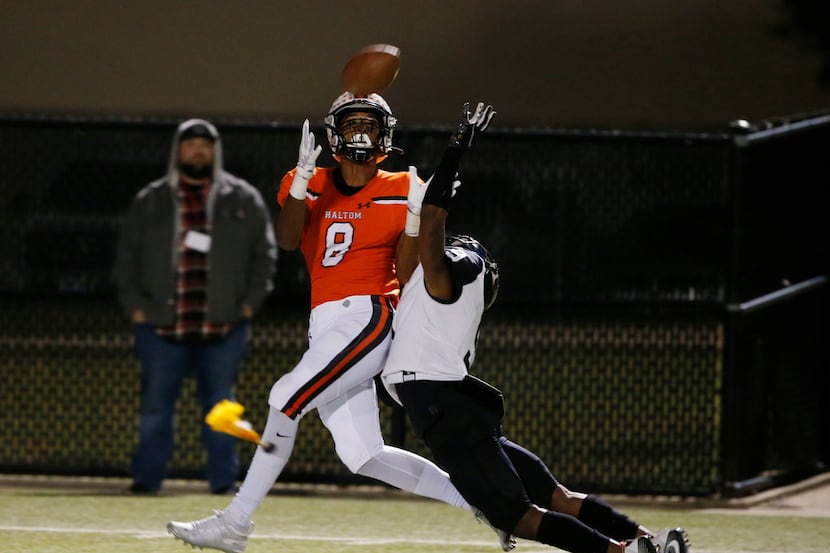 FILE - Haltom's Jace Washington (8) fails to catch a pass but is interfered with by Euless...
