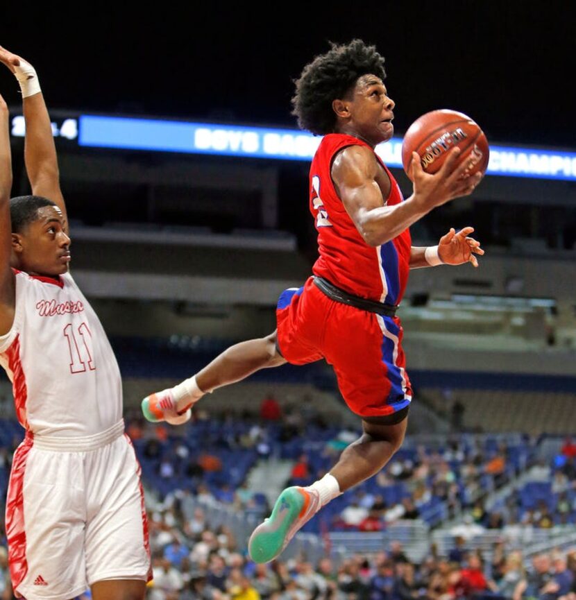 Duncanville's Ja'Bryant Hill #2 grabs a rebound over Galena Park North's Joshua Cooper #0....