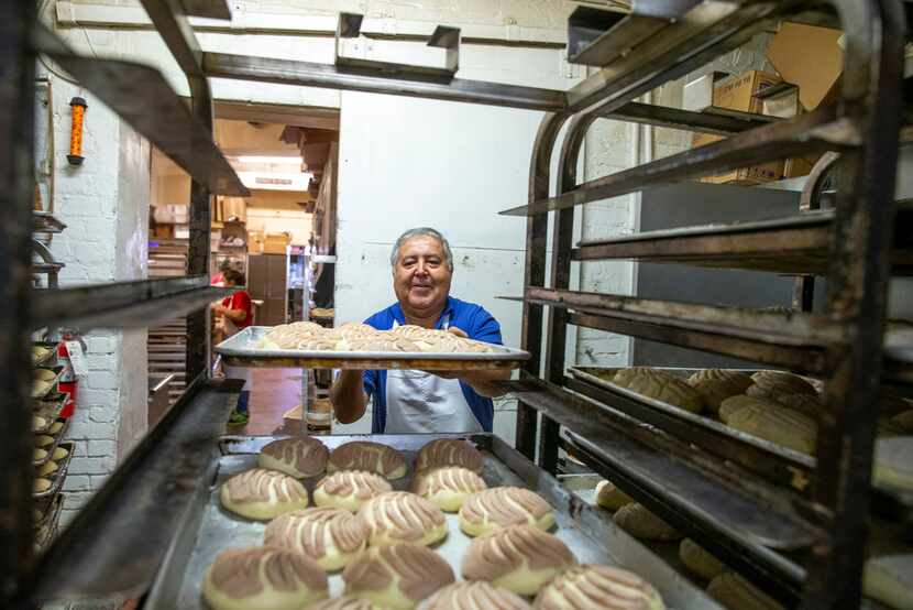 Alfonso Vera, owner of Vera's Bakery Inc., prepares pastries at his shop in Dallas on Nov....