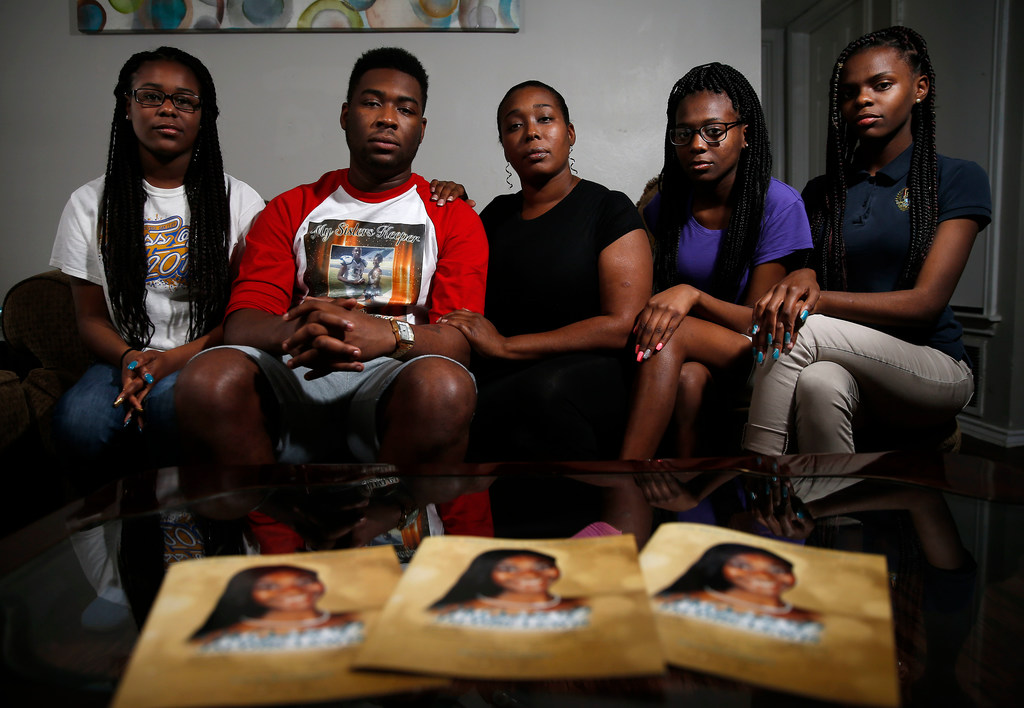 ShaQuaila Jacobs, 36,  center, poses for a photograph with her children, (from left)...