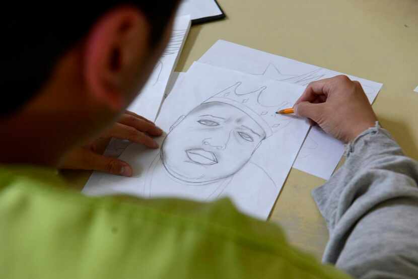 
A boy works on a sketch of The Notorious B.I.G. at the Henry Wade Juvenile Justice Center...