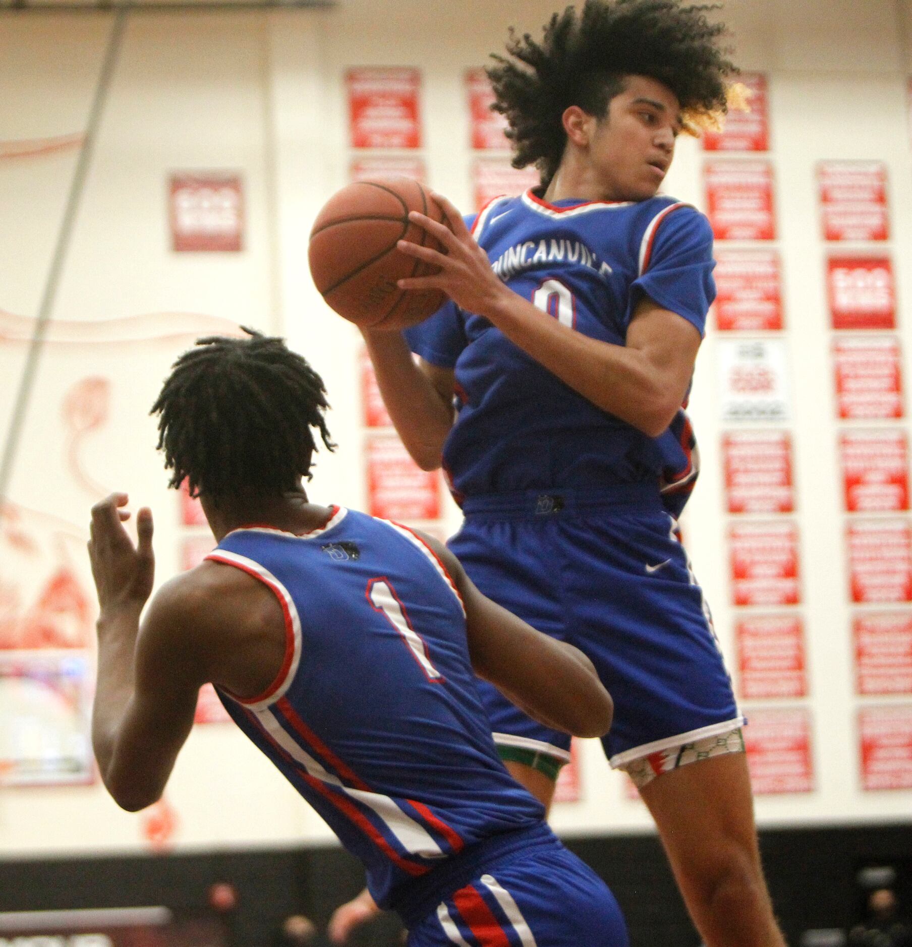 Duncanville point guard Anthony Black (0) leaps to pull down an offensive rebound as forward...
