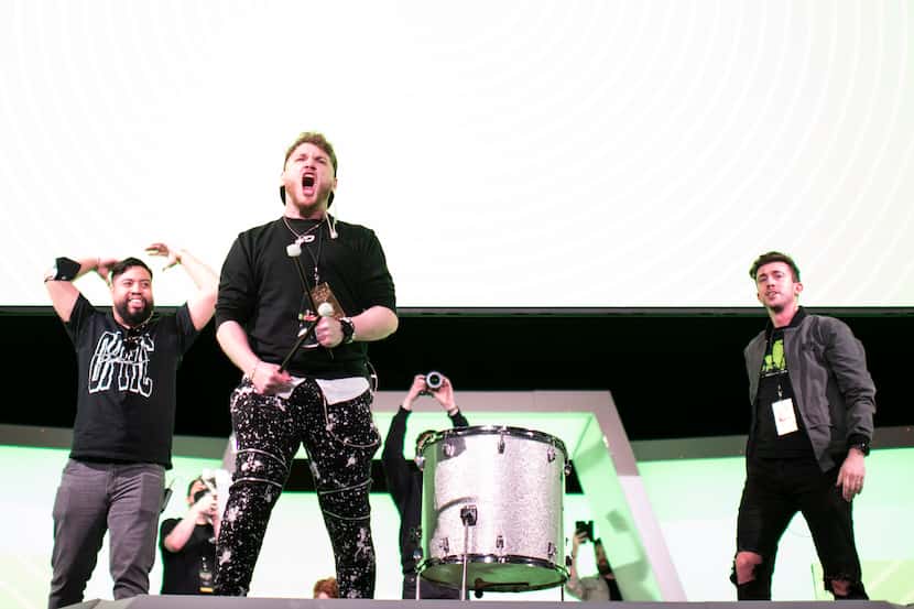 Members of the Optic Texas hype team get the crowd excited prior to the start of OpTic...