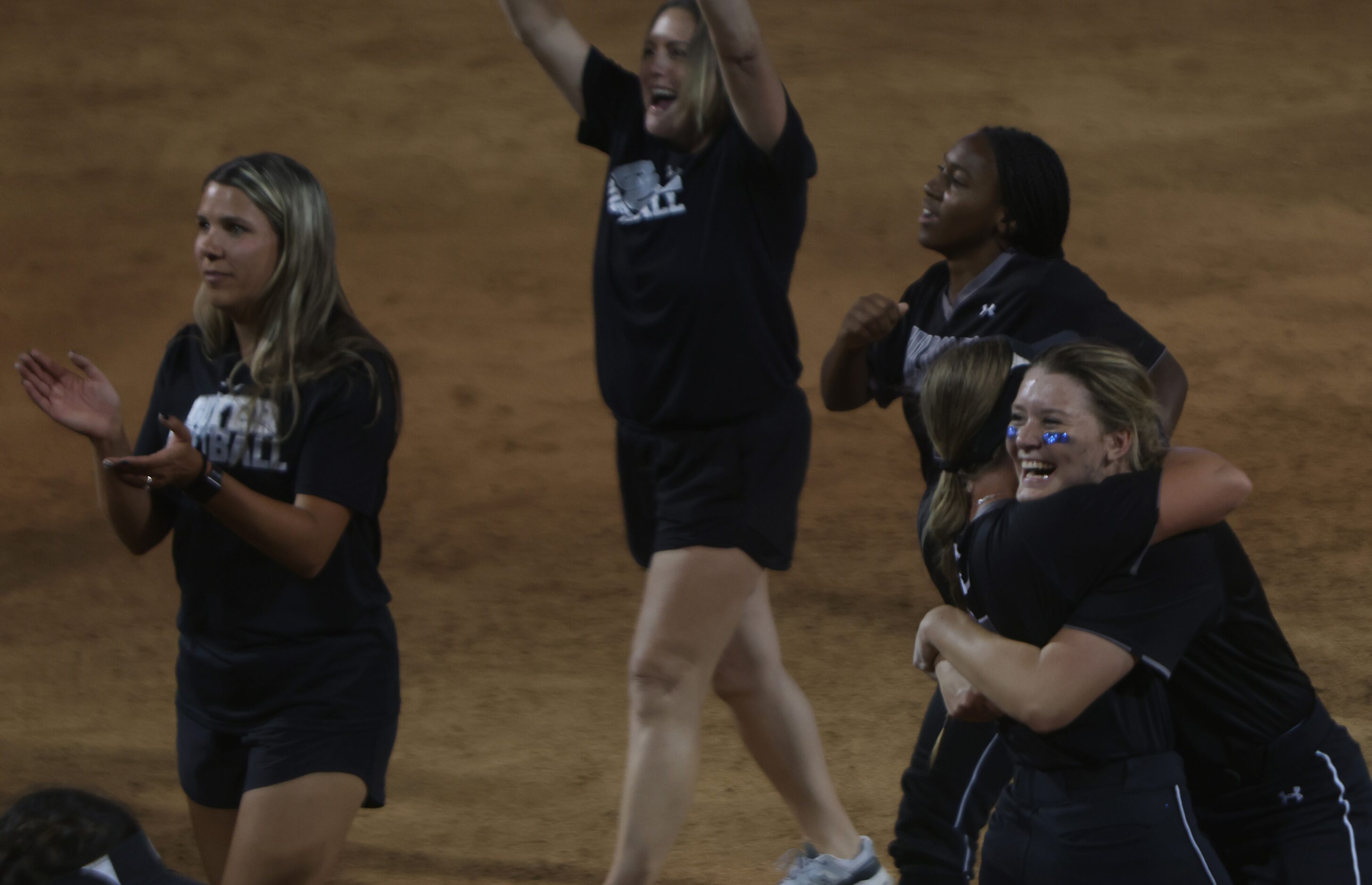 Denton Guyer catcher Jordan Osborne (8), lower right shares a hug with a teammate after...