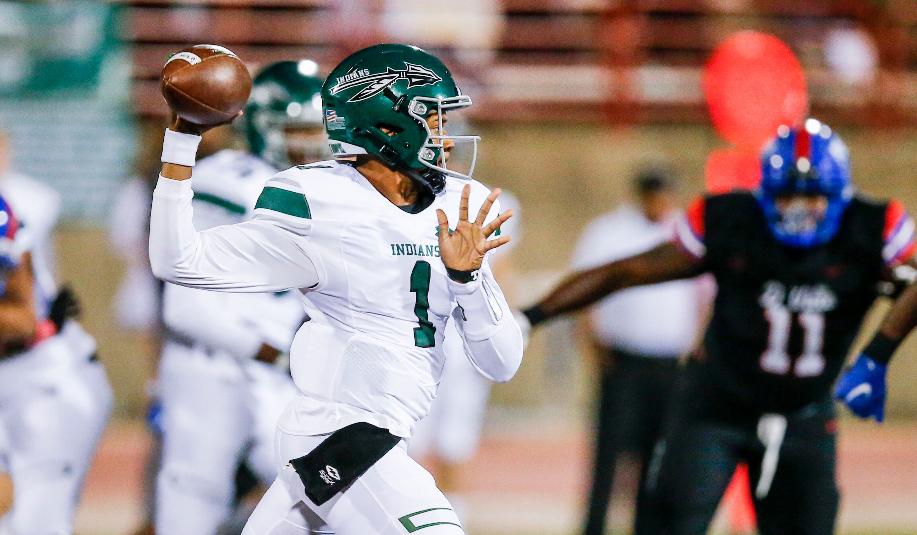 Waxahachie junior quarterback Roderick Hartsfield Jr. (1) throws during the first half of a...