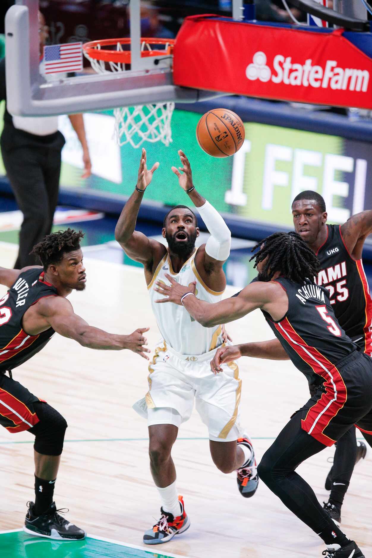 Dallas Mavericks guard Tim Hardaway Jr. (11) loses his grip on the ball as Miami Heat...