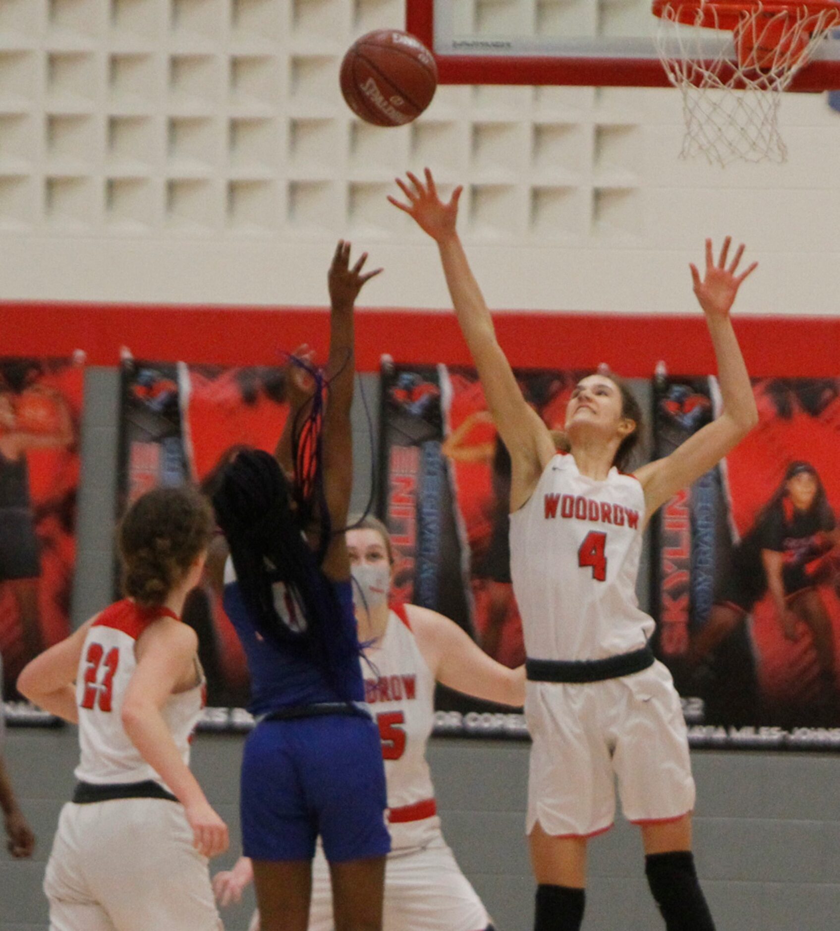 Dallas Woodrow Wilson's Ellery Sample (4) leaps to defend a shot by Dallas Spruce guard...