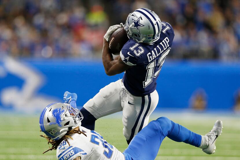 Dallas Cowboys wide receiver Michael Gallup (13) catches a ball hit by Detroit Lions...