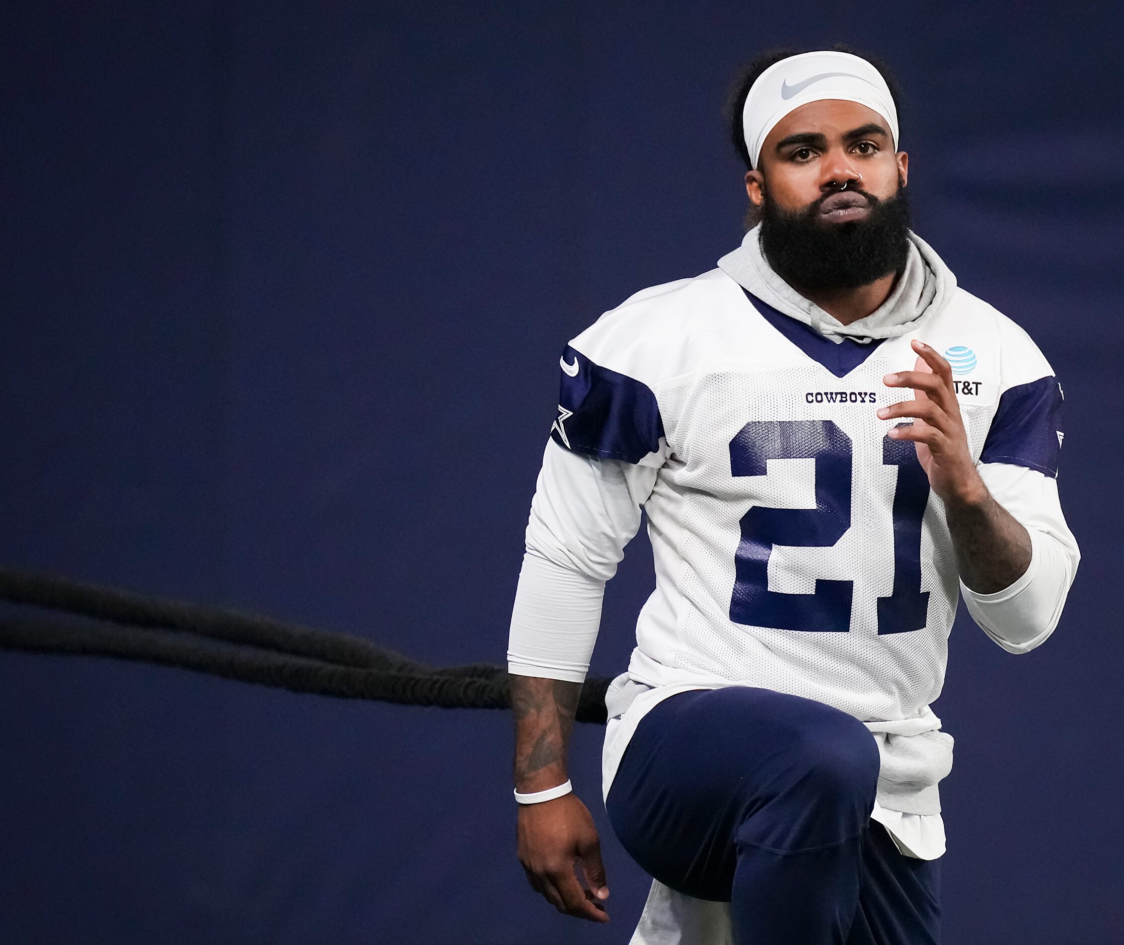 Dallas Cowboys running back Ezekiel Elliott works with a resistance band during the team's...