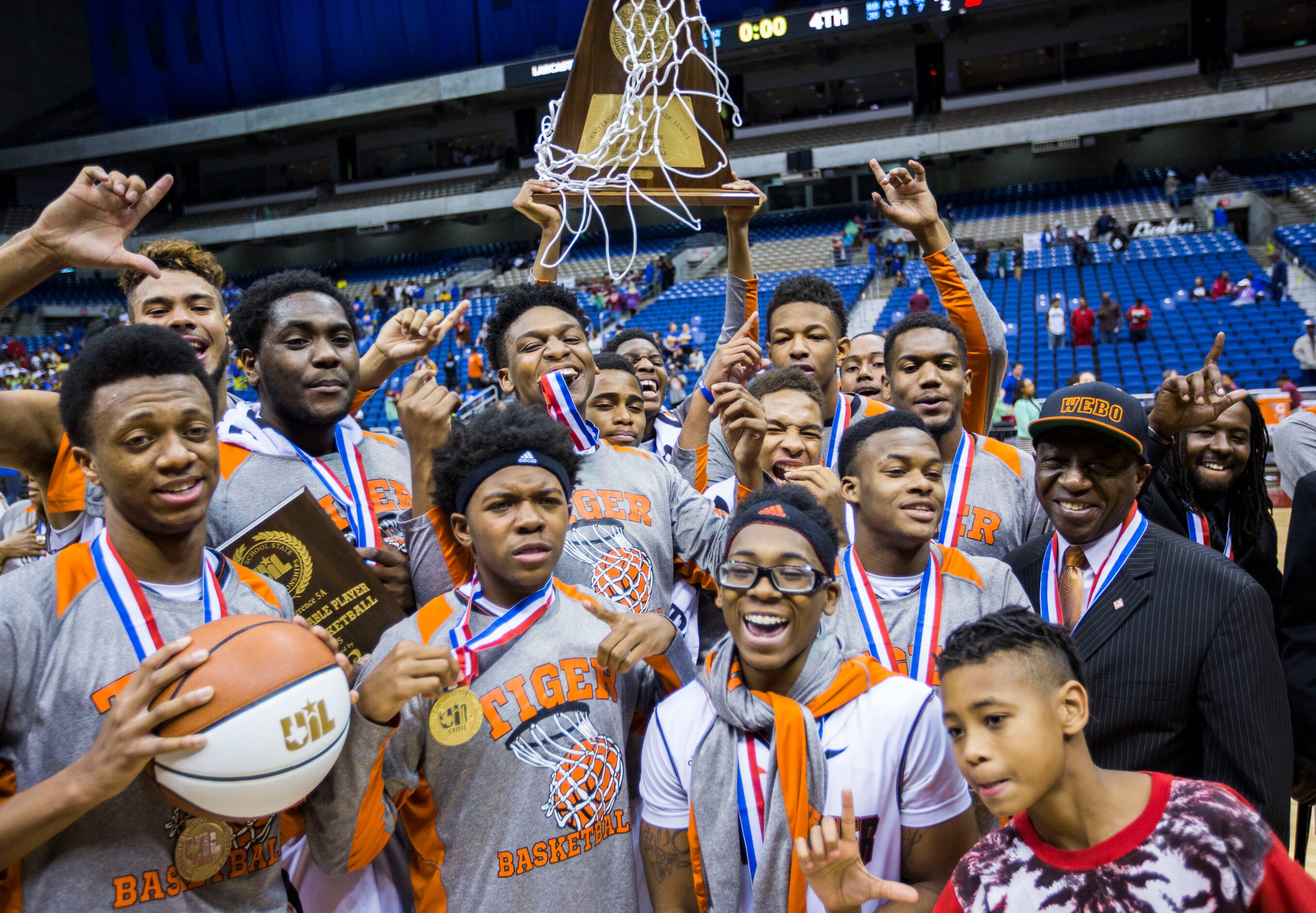 Lancaster celebrates a 59-47 win over Beaumont Ozen at their UIL Class 5A state championship...