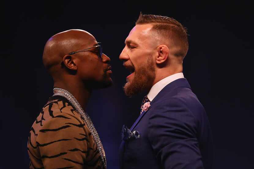 LONDON, ENGLAND - JULY 14:  Floyd Mayweather Jr. and Conor McGregor come face to face during...