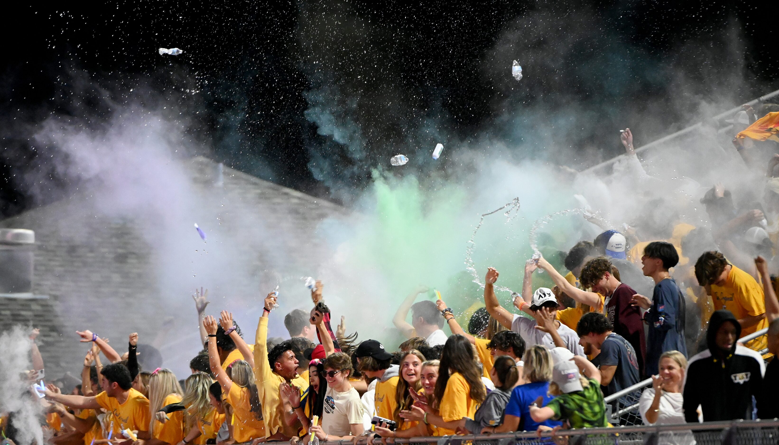 Frisco students celebrate after a turnover recovery in the first half of a high school...