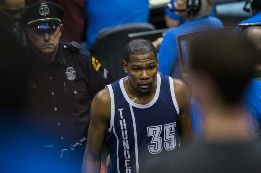 Oklahoma City Thunder forward Kevin Durant (35) is escorted out off the court after being...